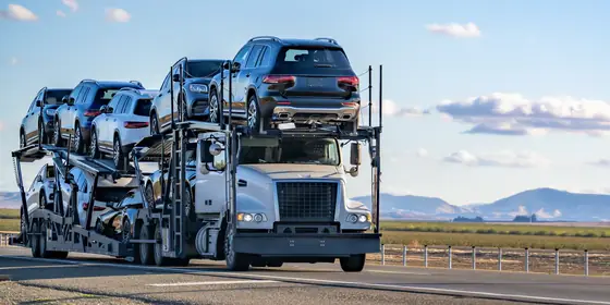 A loaded car carrier on an interstate highway